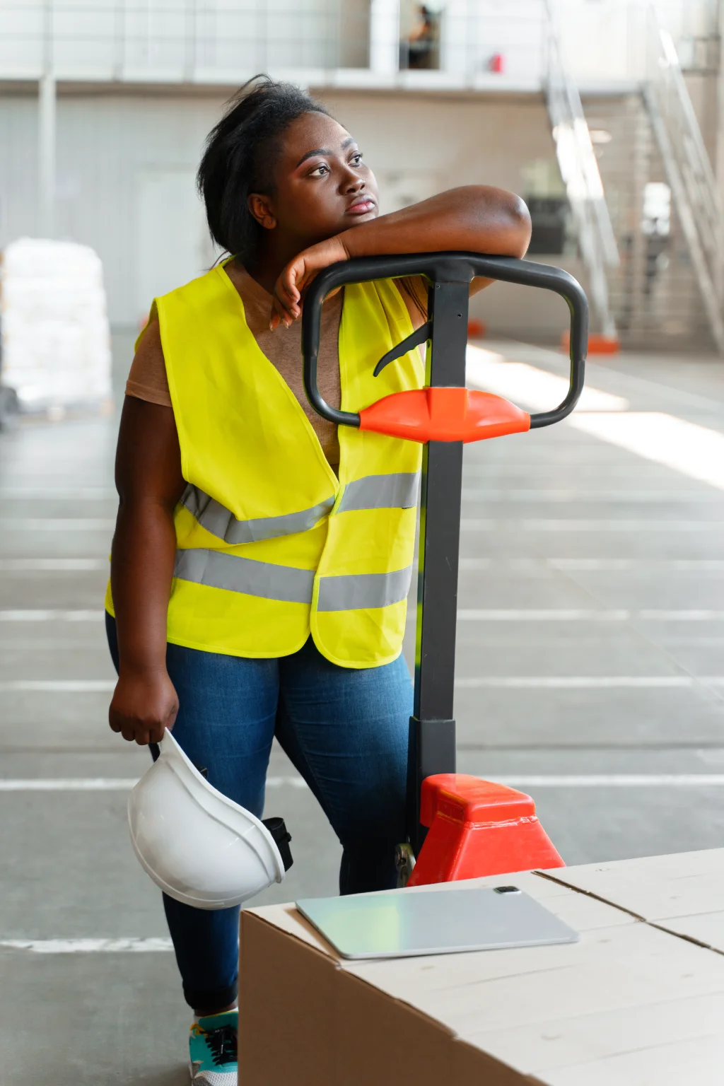 Worker with safety gear in warehouse