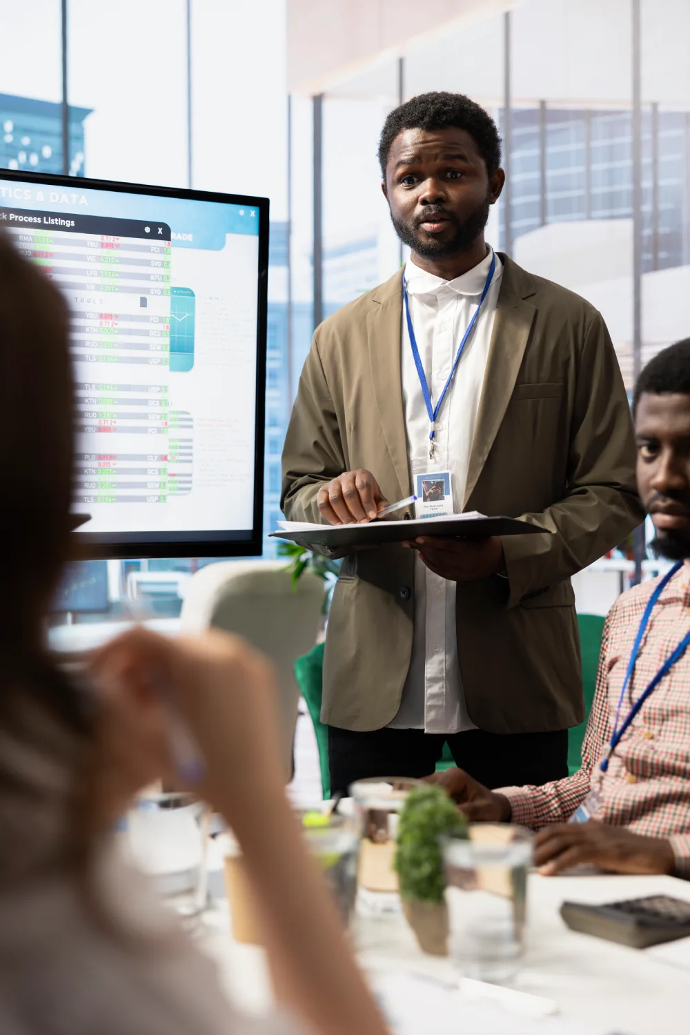 African american ceo leads a corporate briefing meeting